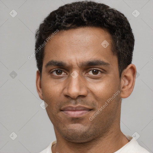 Neutral black young-adult male with short  black hair and brown eyes