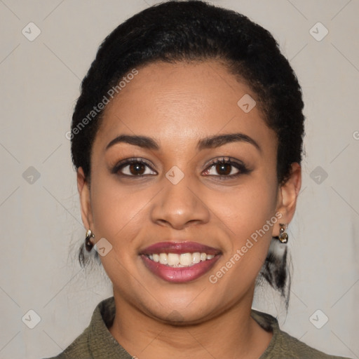 Joyful black young-adult female with short  black hair and brown eyes