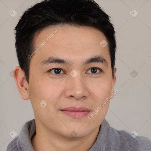 Joyful asian young-adult male with short  brown hair and brown eyes