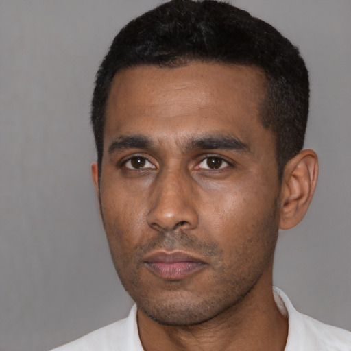 Neutral latino adult male with short  black hair and brown eyes