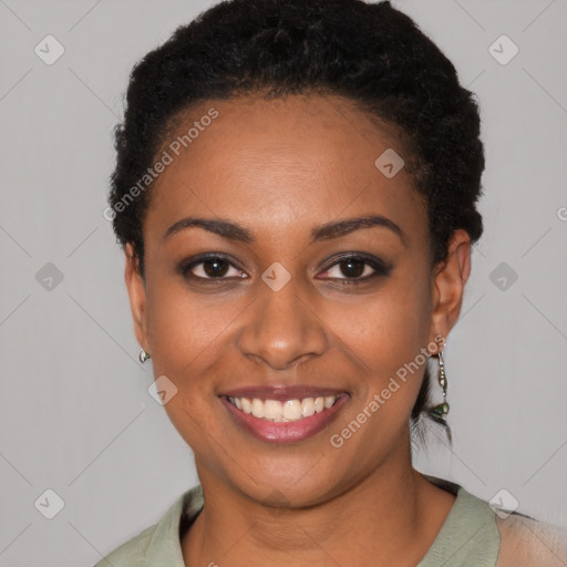 Joyful black young-adult female with short  black hair and brown eyes