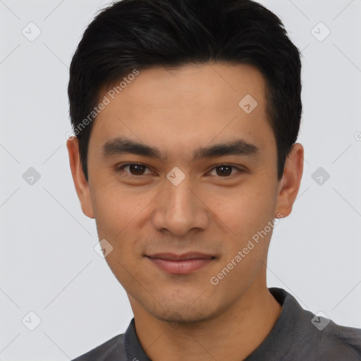 Joyful asian young-adult male with short  black hair and brown eyes