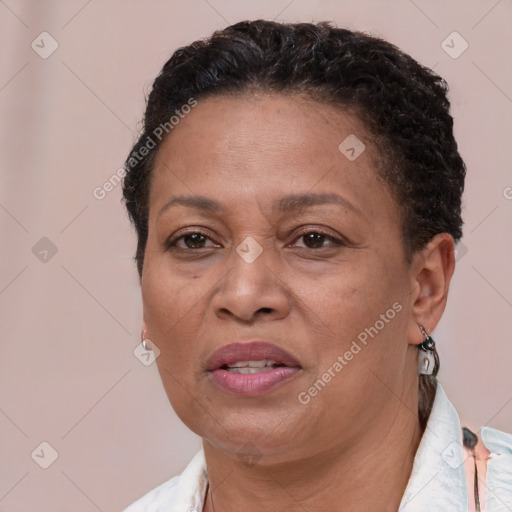 Joyful black adult female with short  brown hair and brown eyes