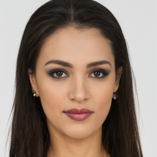 Neutral latino young-adult female with long  brown hair and brown eyes