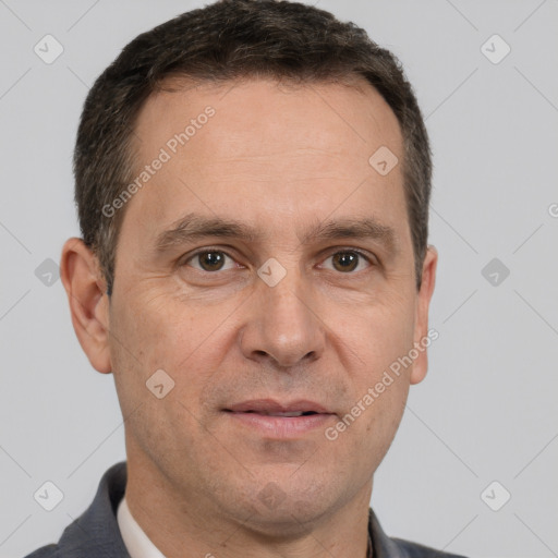 Joyful white adult male with short  brown hair and brown eyes