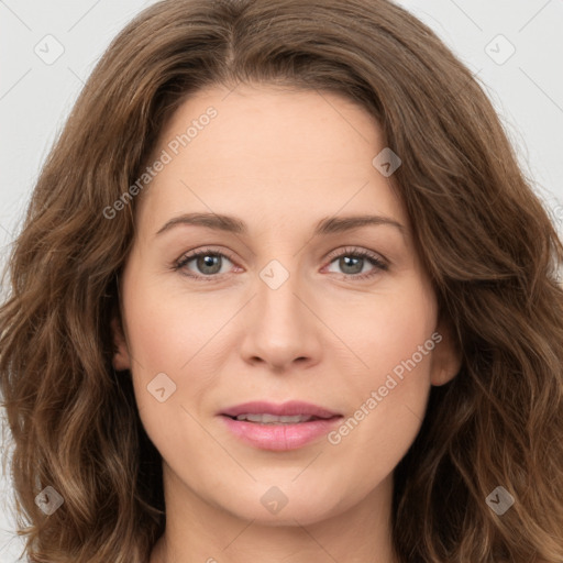 Joyful white young-adult female with long  brown hair and green eyes