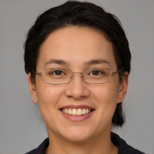 Joyful white adult female with medium  brown hair and brown eyes