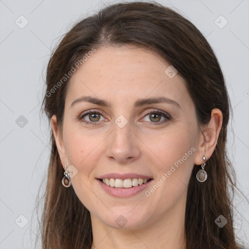 Joyful white young-adult female with long  brown hair and grey eyes