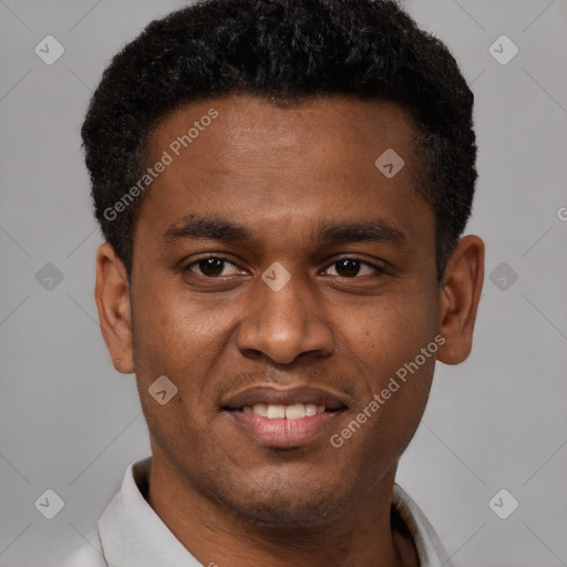 Joyful latino young-adult male with short  brown hair and brown eyes