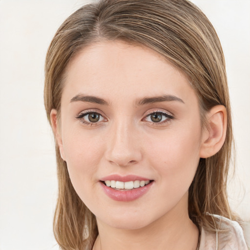 Joyful white young-adult female with long  brown hair and green eyes