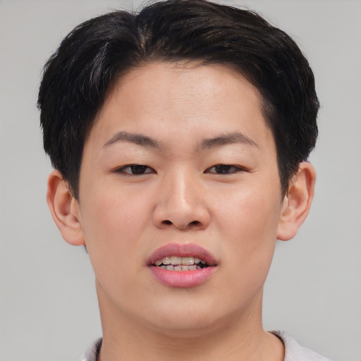 Joyful asian young-adult female with short  brown hair and brown eyes