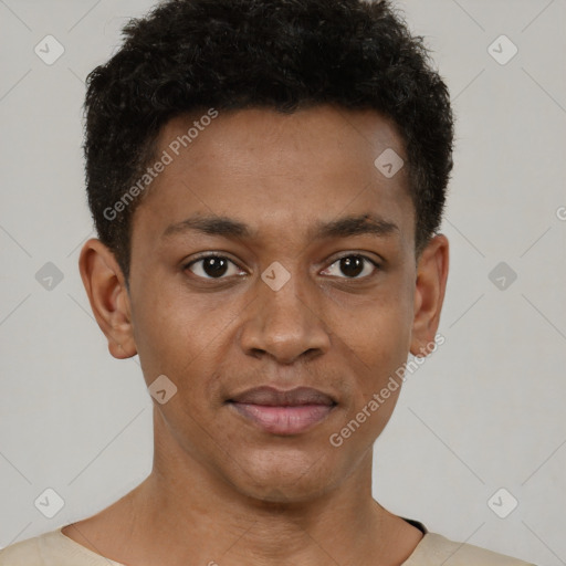Joyful black young-adult male with short  brown hair and brown eyes