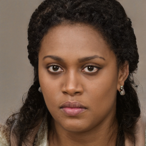 Neutral black young-adult female with long  brown hair and brown eyes