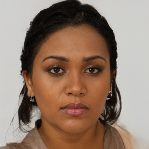 Neutral black young-adult female with long  brown hair and brown eyes