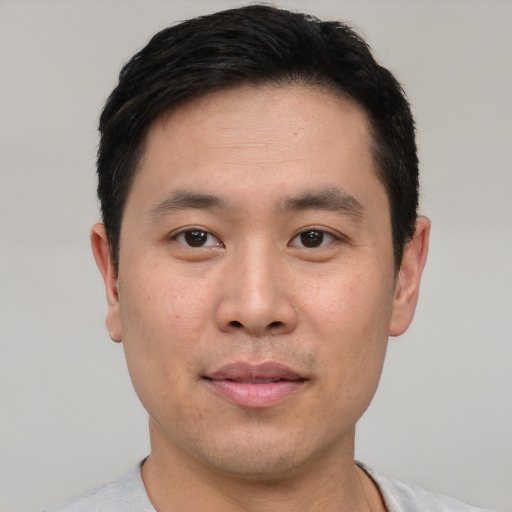 Neutral asian young-adult male with short  black hair and brown eyes