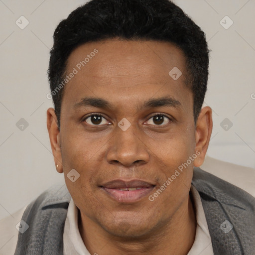 Joyful black young-adult male with short  black hair and brown eyes