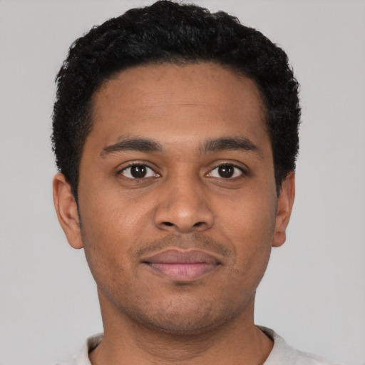 Neutral latino young-adult male with short  brown hair and brown eyes