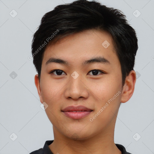 Joyful asian young-adult male with short  black hair and brown eyes