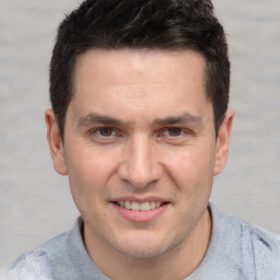 Joyful white adult male with short  brown hair and brown eyes