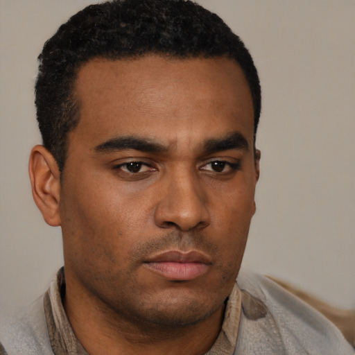 Neutral latino young-adult male with short  brown hair and brown eyes