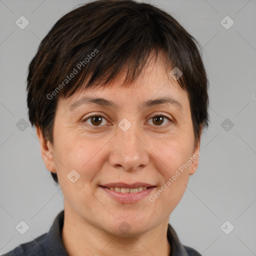 Joyful white adult female with short  brown hair and brown eyes