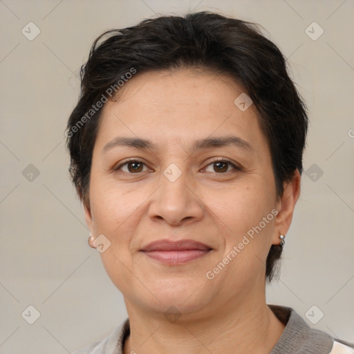 Joyful white adult female with short  brown hair and brown eyes