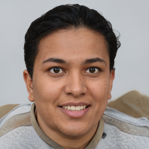 Joyful latino young-adult female with short  brown hair and brown eyes