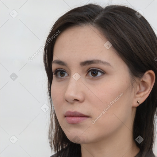 Neutral white young-adult female with long  brown hair and brown eyes