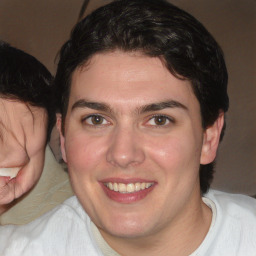 Joyful white young-adult male with medium  brown hair and brown eyes