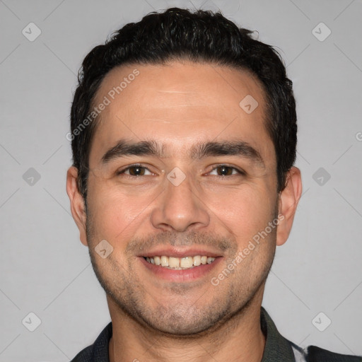 Joyful white young-adult male with short  black hair and brown eyes