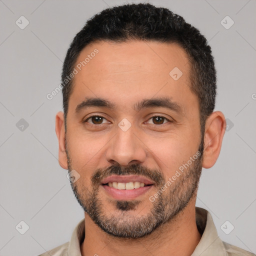 Joyful white young-adult male with short  black hair and brown eyes