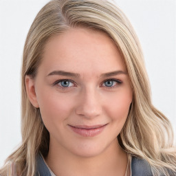 Joyful white young-adult female with long  brown hair and blue eyes