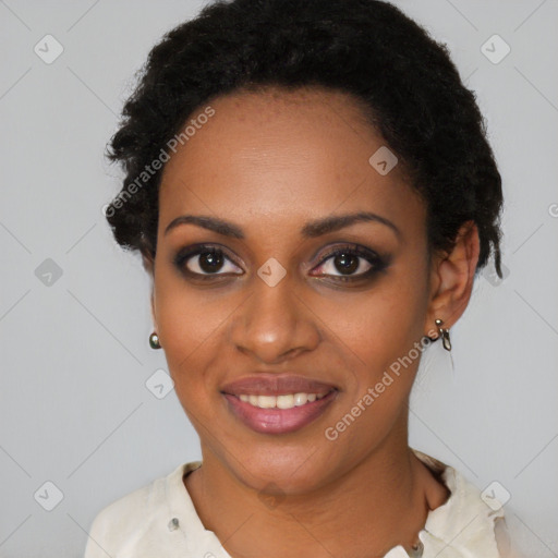 Joyful black young-adult female with short  black hair and brown eyes