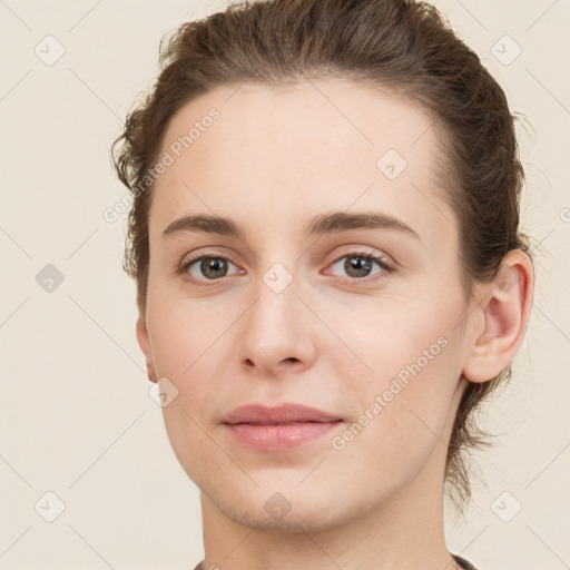 Neutral white young-adult female with short  brown hair and brown eyes