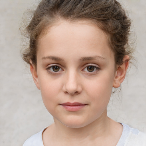 Joyful white child female with short  brown hair and brown eyes