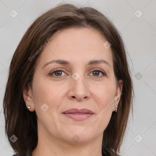 Joyful white adult female with medium  brown hair and grey eyes