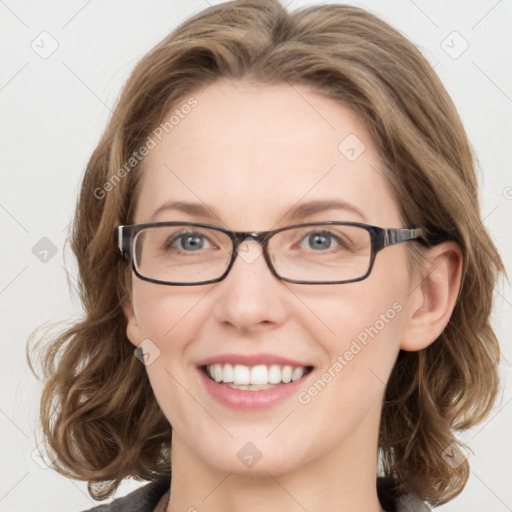 Joyful white young-adult female with medium  brown hair and blue eyes