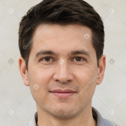 Joyful white adult male with short  brown hair and brown eyes