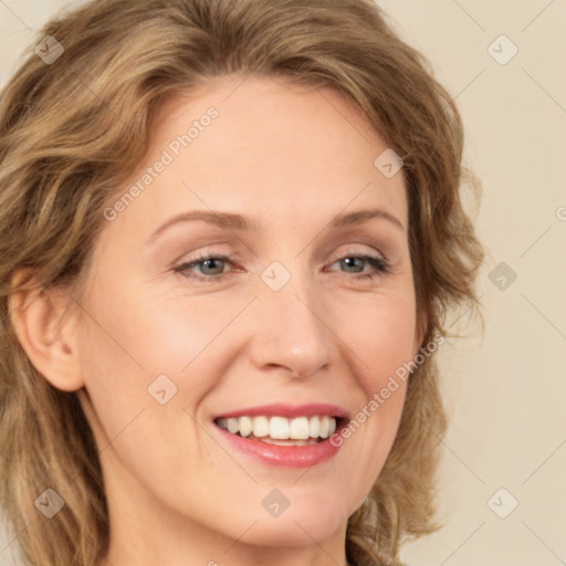 Joyful white young-adult female with long  brown hair and green eyes