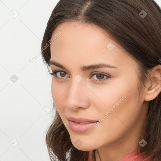 Neutral white young-adult female with long  brown hair and brown eyes