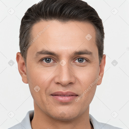 Joyful white adult male with short  brown hair and brown eyes