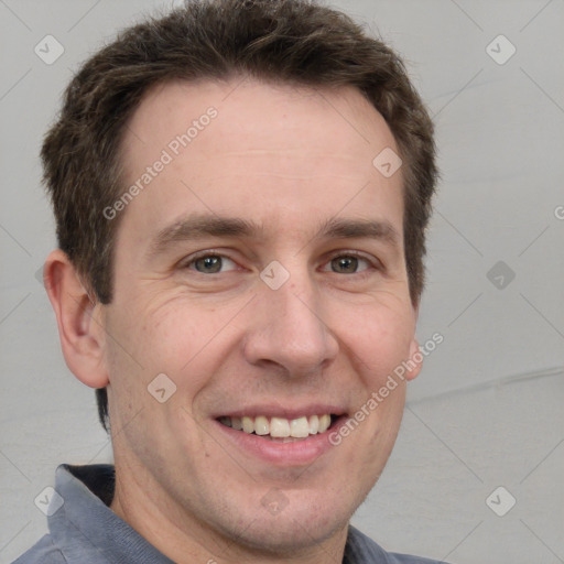 Joyful white adult male with short  brown hair and grey eyes