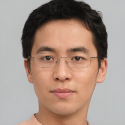 Neutral asian young-adult male with short  brown hair and brown eyes