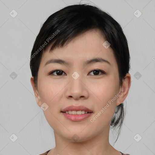 Joyful asian young-adult female with medium  black hair and brown eyes