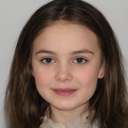 Joyful white child female with medium  brown hair and brown eyes