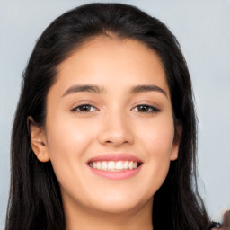 Joyful latino young-adult female with long  black hair and brown eyes