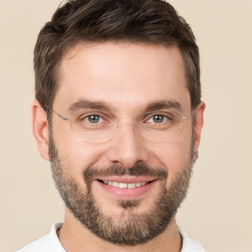 Joyful white young-adult male with short  brown hair and brown eyes