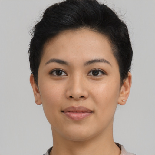 Joyful asian young-adult female with short  black hair and brown eyes