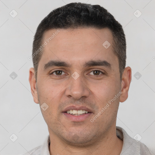 Joyful white young-adult male with short  brown hair and brown eyes