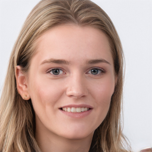 Joyful white young-adult female with long  brown hair and blue eyes